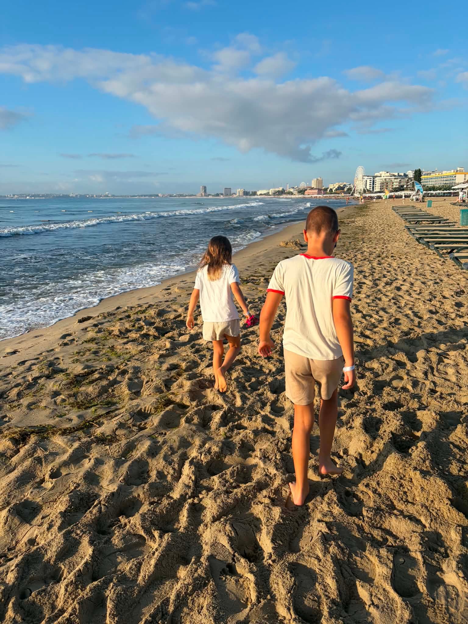 Our two children walking along the beach in Sunny Beach, Bulgaria
